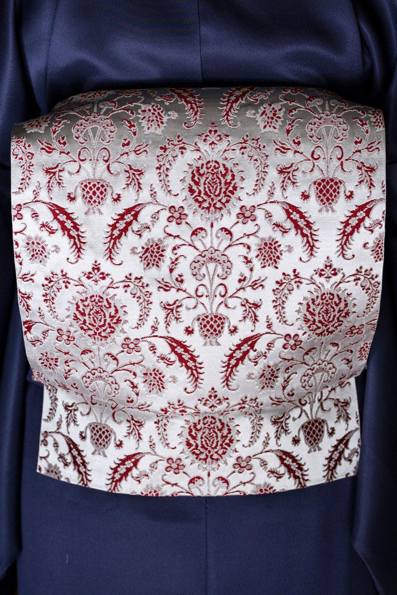 【新色/期限特典】 博多織八寸名古屋帯 ペルシャ草花紋　薄鼠地に深紅　[紅衣オリジナル] - 木下着物研究所